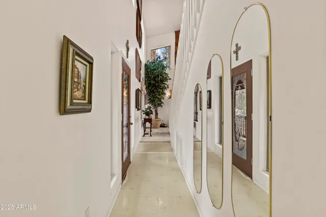 a view of a hallway view with staircase