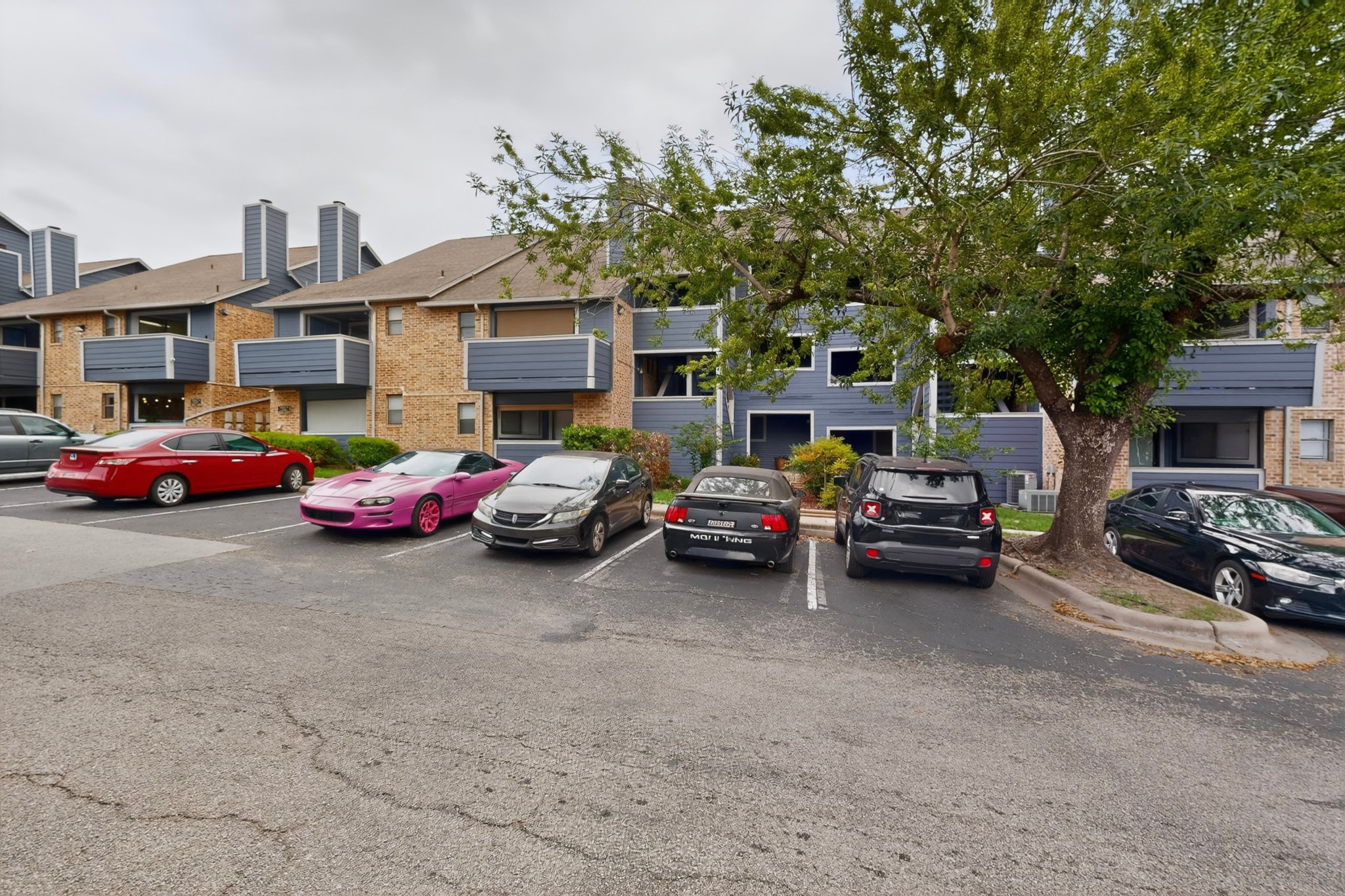 2500 Burleson Road, Unit 506 Austin, TX 78741 - Photo 4 of 23 a view of a cars parked in front of a building