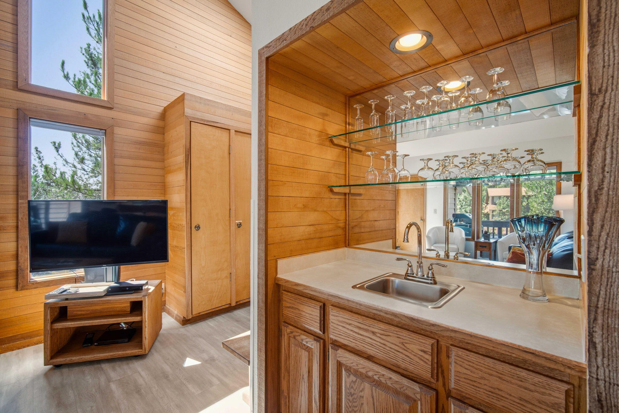57305 Beaver Ridge Loop, Unit 8 Sunriver, OR 97707 - Photo 6 of 25 a bathroom with a sink a mirror and next to a window