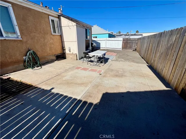 a bedroom with furniture and a flat screen tv