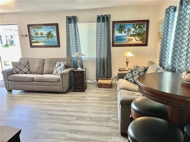 a room with pool table and windows