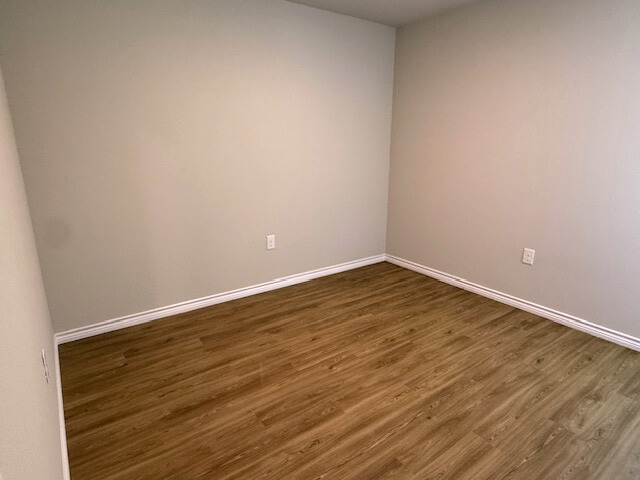 2410 Westcliff Road Killeen, TX 76543 - Photo 16 of 18 A versatile room features attractive wood-look flooring and clean, neutral walls, ready for personalization.