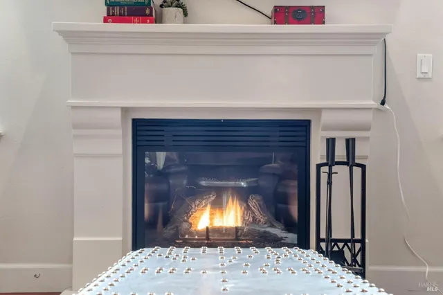 a kitchen with stainless steel appliances granite countertop a refrigerator a stove a sink dishwasher and a microwave with wooden floor