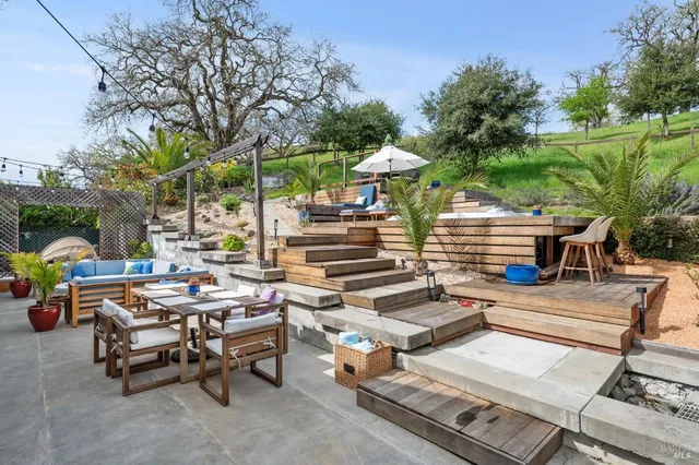 a view of a patio with swimming pool table and chairs
