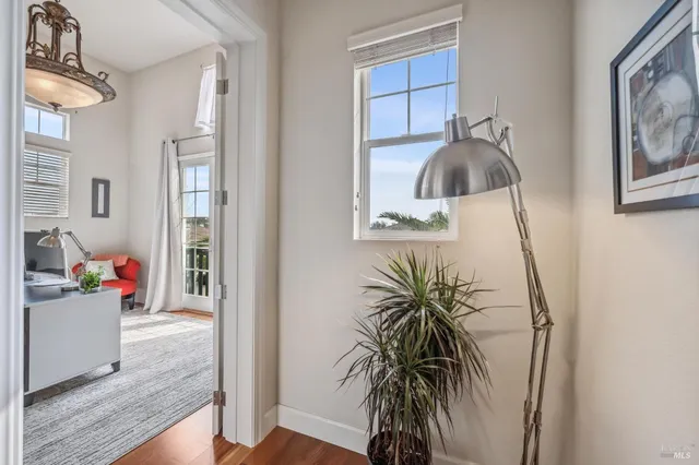 a living room with furniture and a book shelf