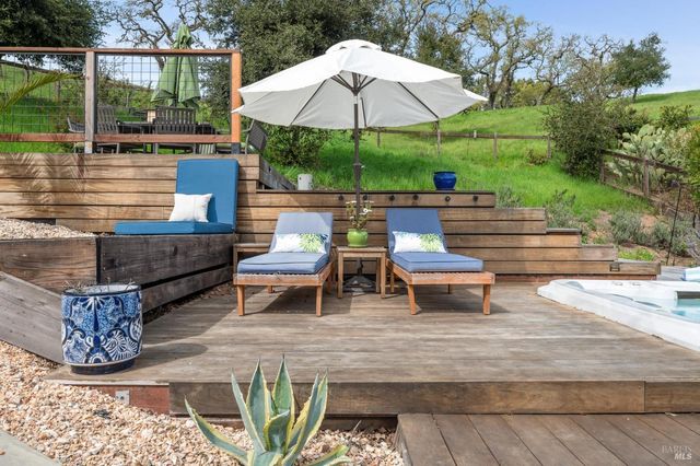 a view of a house with backyard space and a patio
