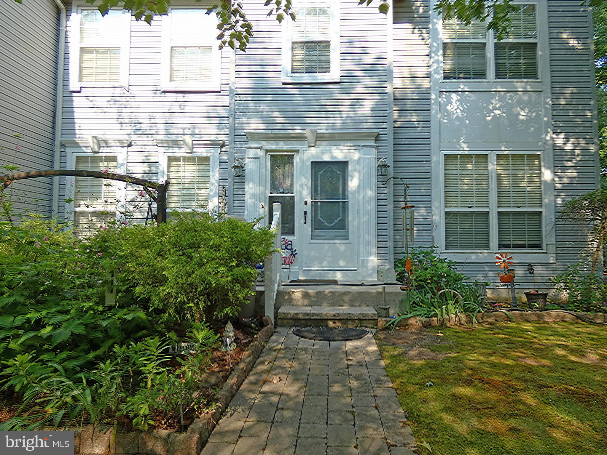 111 Hawthorne Road Egg Harbor Township, NJ 08234 - Photo 4 of 10 Doorway of house highlighting brick walkway
