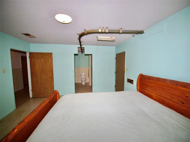 a view of storage and utility room with two washing machine