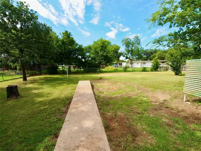 a view of a garden with a building