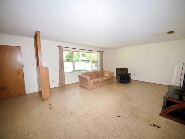 a big room with windows and closet