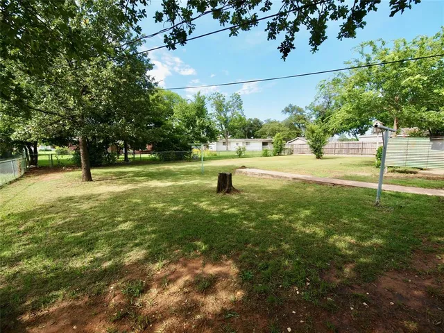 a view of swimming pool with a tree