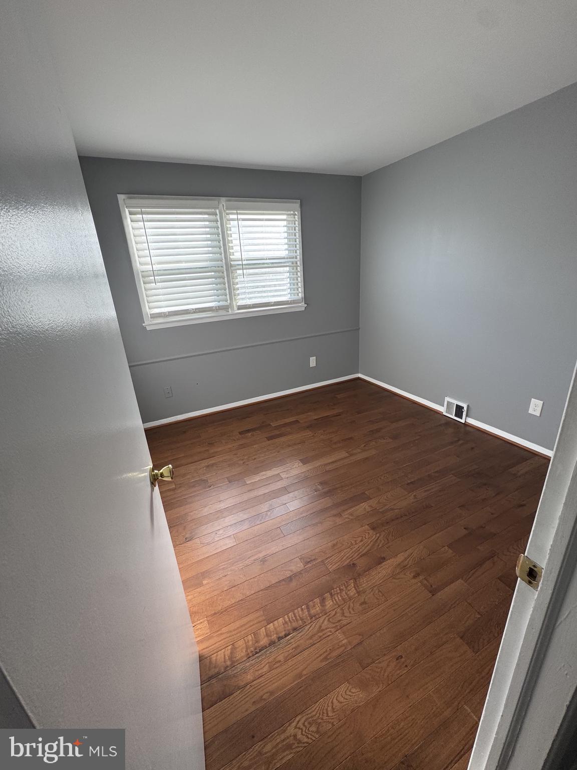 7410 Dickenson Street Springfield, VA 22150 - Photo 6 of 14 Bright and airy room with hardwood floors.