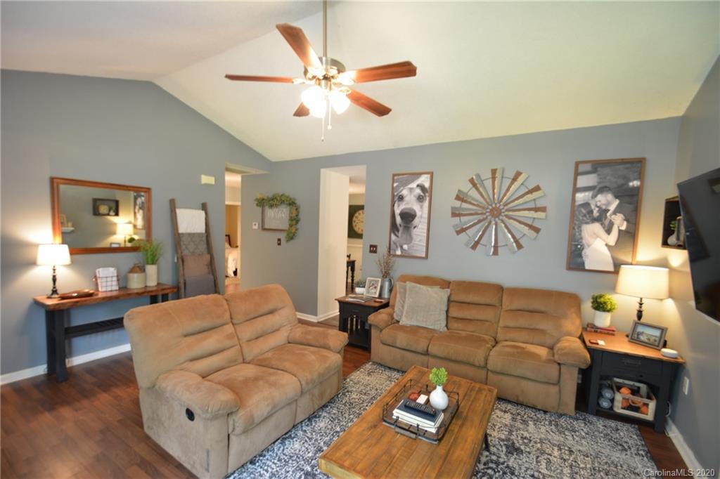 324 Radio Road, Unit 4 Charlotte, NC 28216 - Photo 7 of 19 a living room with furniture and wooden floor