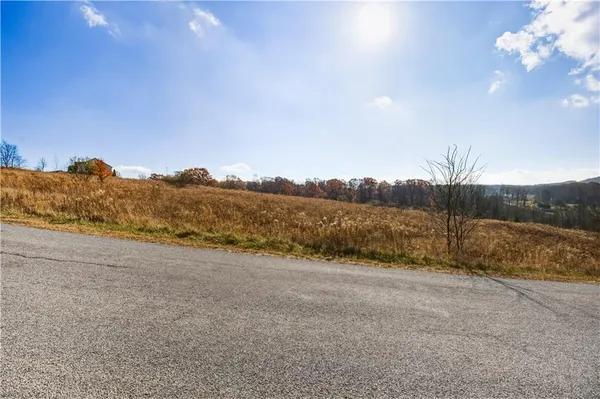a view of a road with an ocean view