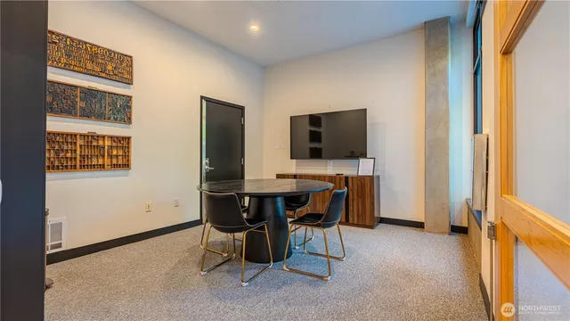 a view of a workspace with furniture