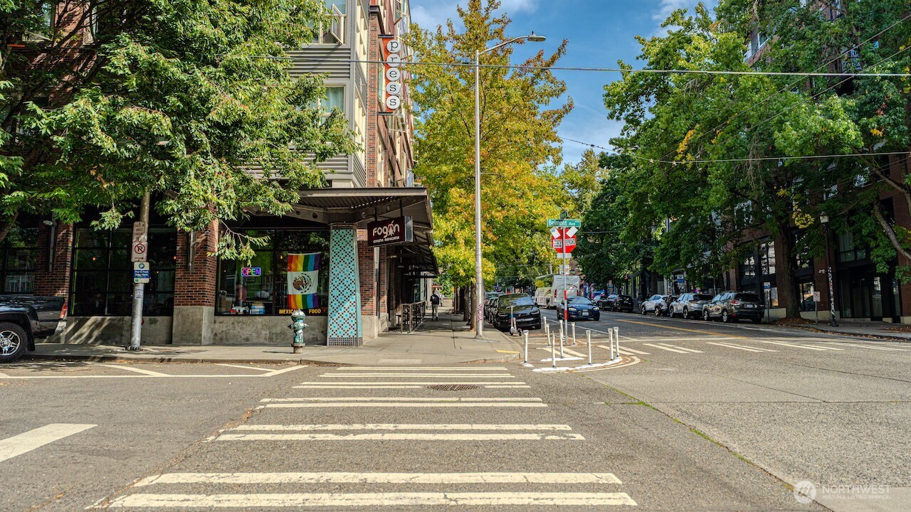 1620 Belmont Avenue, Unit 226 Seattle, WA 98122 - Photo 18 of 19 a view of a building with a bench in a patio