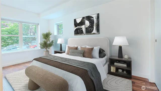 a bedroom with a bed and a window