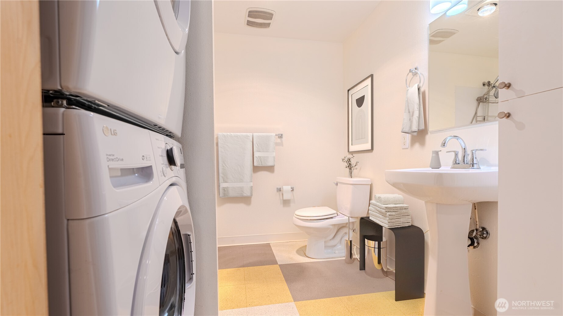 1620 Belmont Avenue, Unit 226 Seattle, WA 98122 - Photo 9 of 19 a white toilet sitting next to a bathroom sink