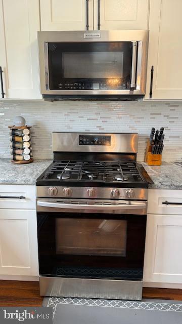 7907 Subet Road Windsor Mill, MD 21244 - Photo 8 of 31 a stove top oven sitting inside of a kitchen