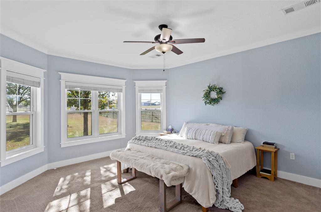 14728 Songbird Lane Haslet, TX 76052 - Photo 13 of 40 a bedroom with a bed and window