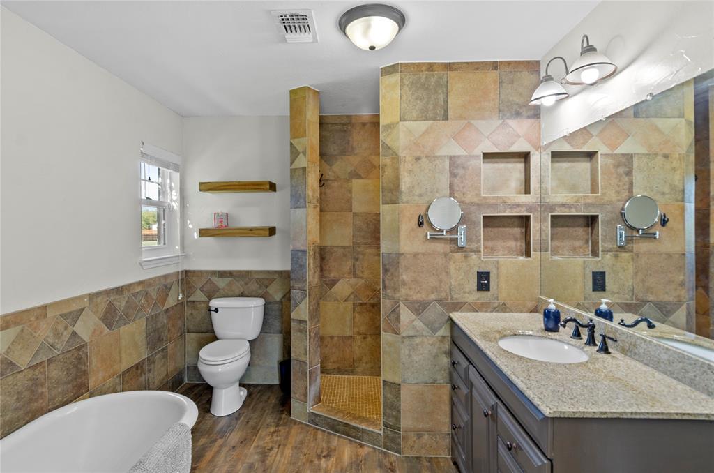 14728 Songbird Lane Haslet, TX 76052 - Photo 17 of 40 a bathroom with a granite countertop toilet sink and shower