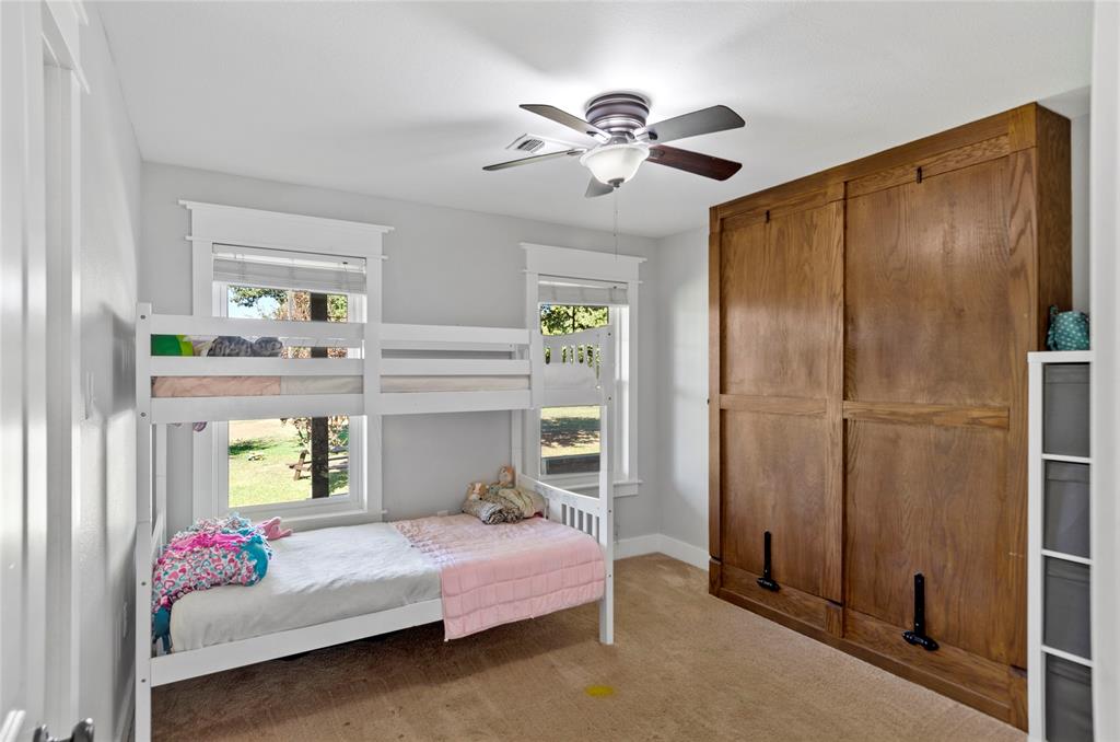 14728 Songbird Lane Haslet, TX 76052 - Photo 19 of 40 a bedroom with a bed and a window