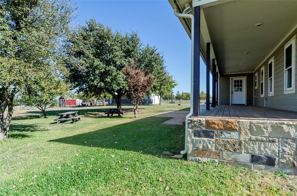 14728 Songbird Lane Haslet, TX 76052 - Photo 24 of 40 a garden with trees in the background