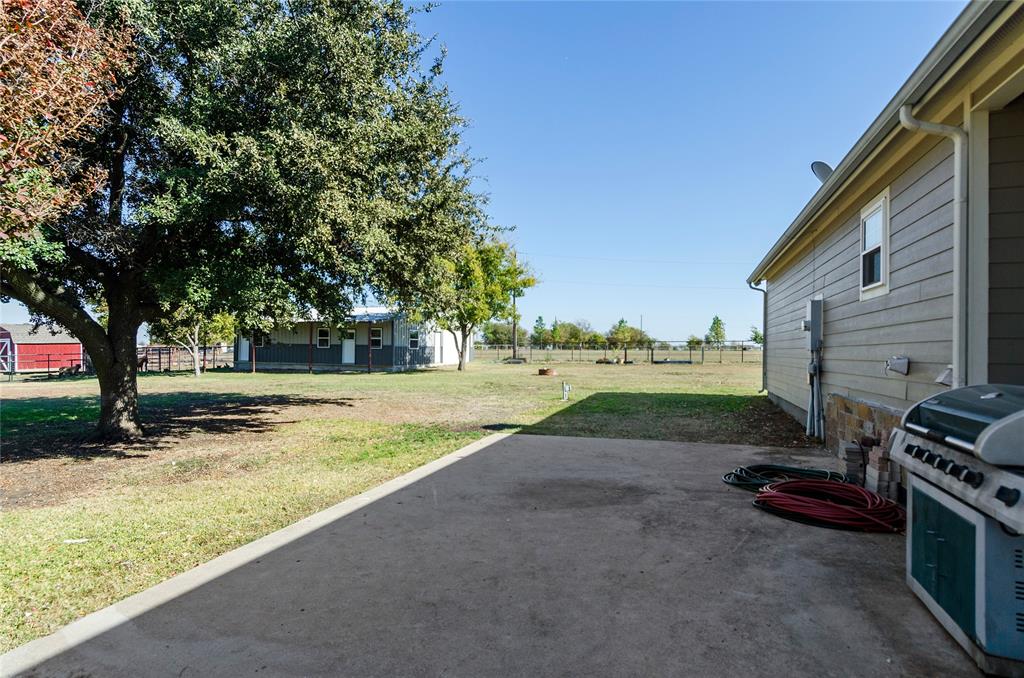 14728 Songbird Lane Haslet, TX 76052 - Photo 25 of 40 a view of a backyard with a table and chairs