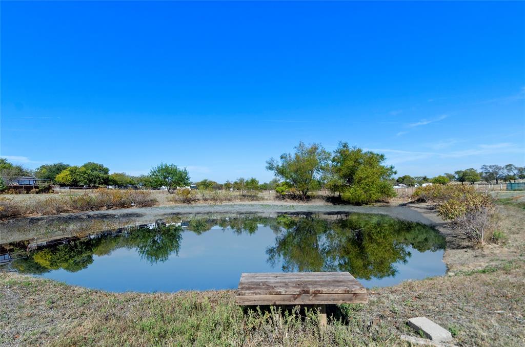 14728 Songbird Lane Haslet, TX 76052 - Photo 6 of 40 a view of a lake from a yard