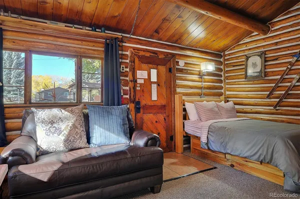 a livingroom with furniture and a large window