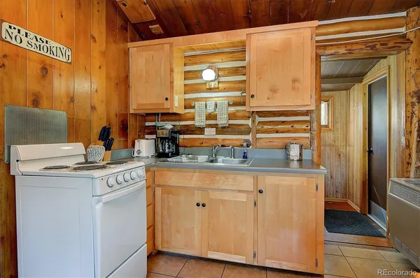 a kitchen with cabinets and window