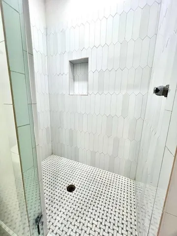 a bathroom with a bathtub and a toilet