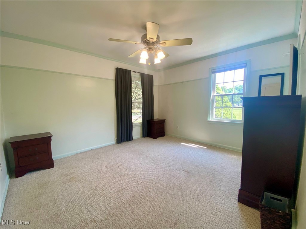 1568 Sunview Road Cleveland, OH 44124 - Photo 20 of 50 Main first floor bedroom with carpet flooring and a ceiling fan