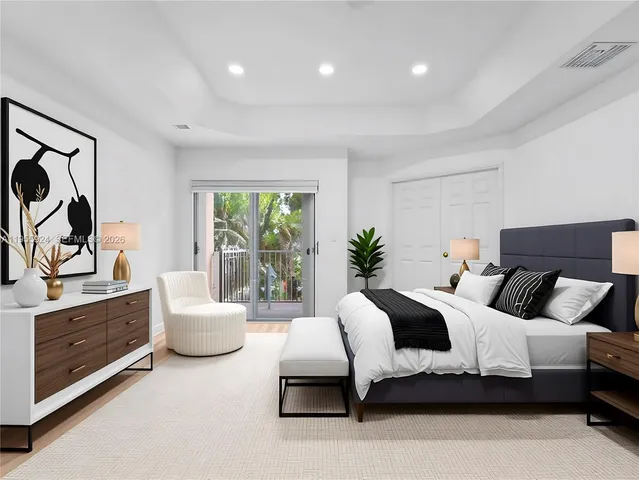 a bedroom with a bed and a couch