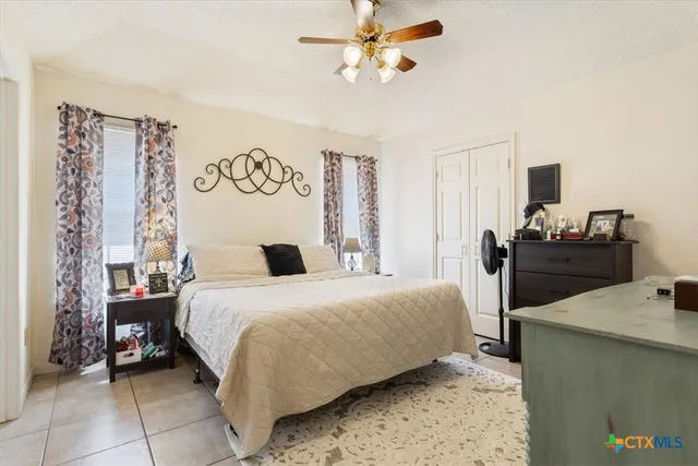 a bedroom with a bed and a table