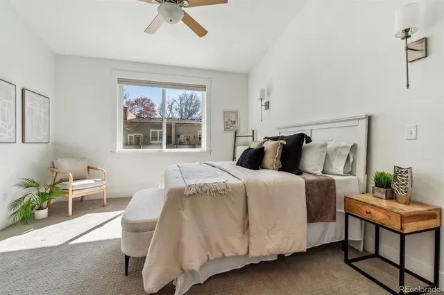 a bedroom with a bed and window