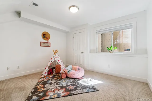 a workspace with furniture and a potted plant