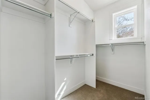 a car parked in front of a white building