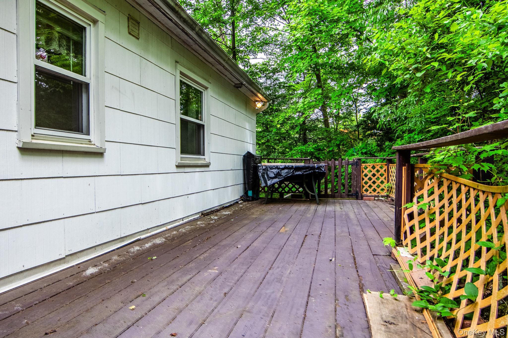 36 Rochambeau Road Garrison, NY 10524 - Photo 36 of 39 Back deck which leads to another sitting area on the side of the house