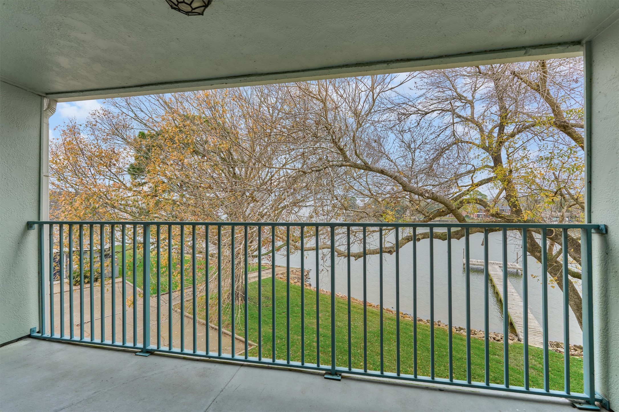 1427 Bowsprit Point Willis, TX 77318 - Photo 35 of 47 One feels as if they are in the treetops while on this balcony! Relax with open views of Lake Conroe.