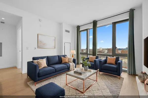 a living room with furniture and a large window