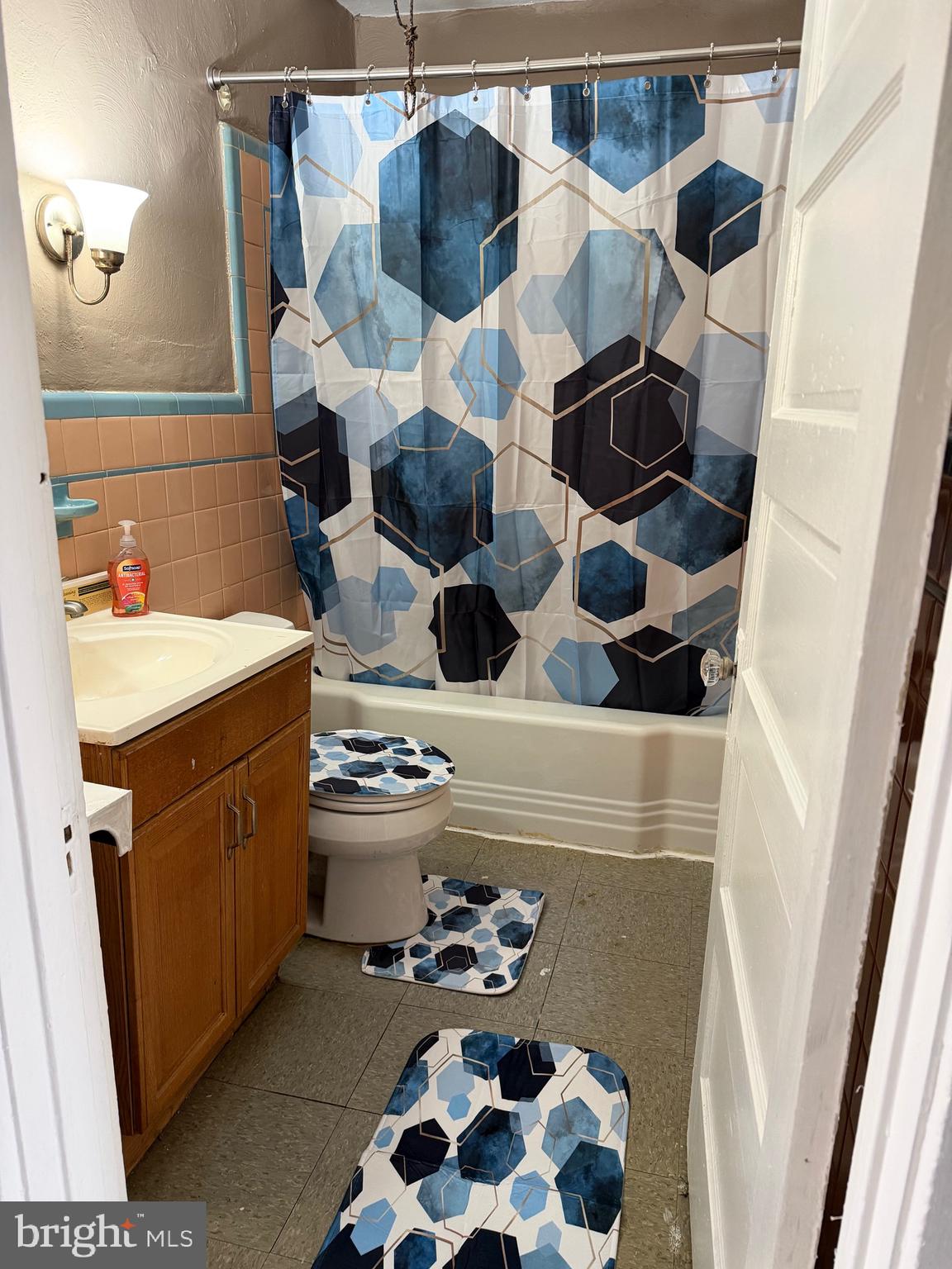 2519 Hobson Street Philadelphia, PA 19142 - Photo 7 of 8 a bathroom with a sink and a mirror