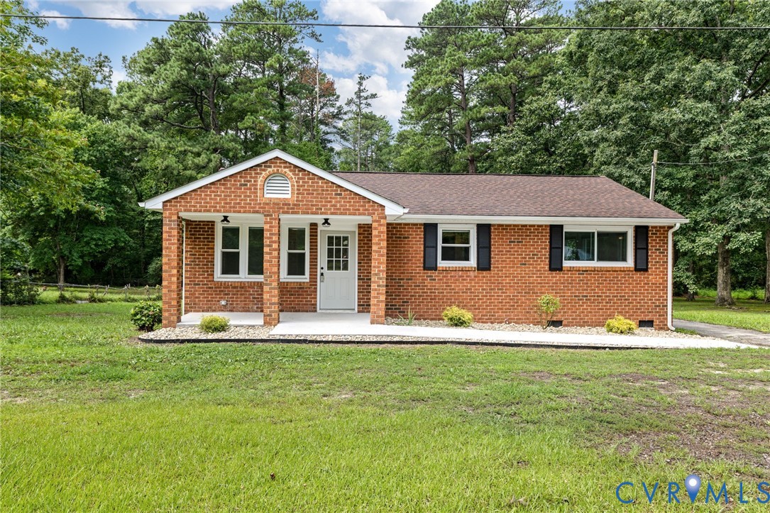 27523 Flank Road Petersburg, VA 23805 - Photo 1 of 34 Brick exterior with white trim, featuring a covere