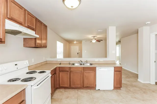 a kitchen with a stove and a sink