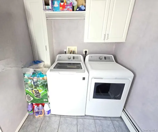 a utility room with dryer and washer