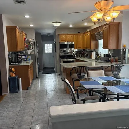 a kitchen with kitchen island granite countertop lots of counter top space
