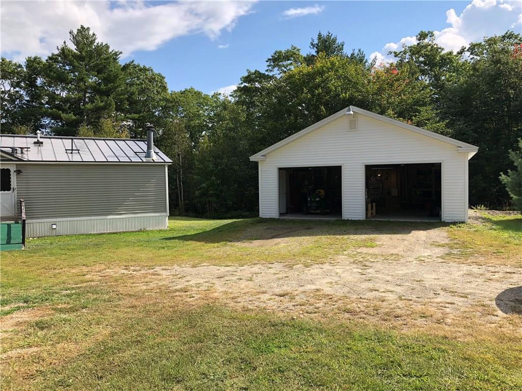 1409 West Appleton Road Appleton, ME 04862 - Photo 4 of 26 The two-car garage sits right beside...