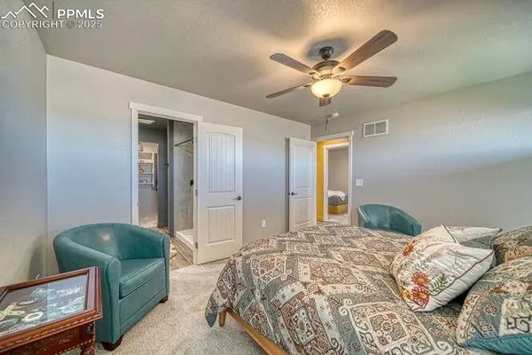 a bedroom with bed and window