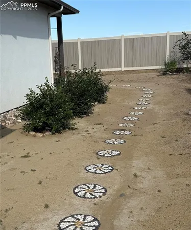 a view of a back yard of the house
