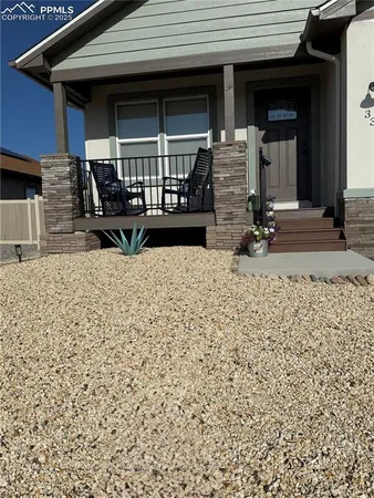 a view of house with patio